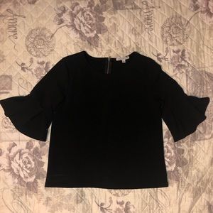 Black crepe top, pleated/peplum sleeves. Size M.